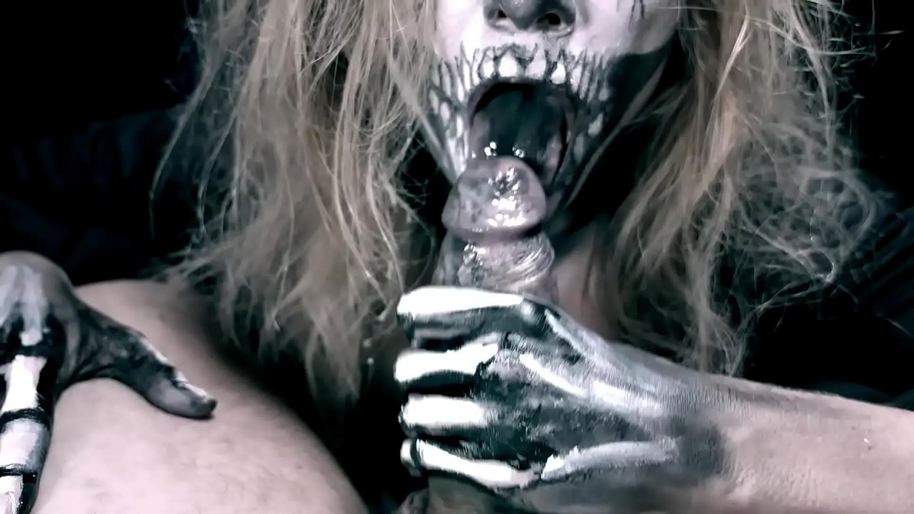 Demon girl sucking cock with her black mouth and swallowing cum.